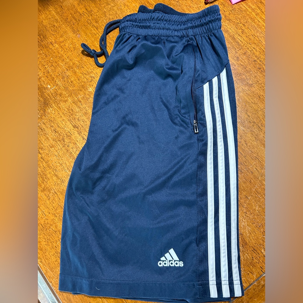 Adidas - navy blue shorts means size large. Draw string with zippered pockets.